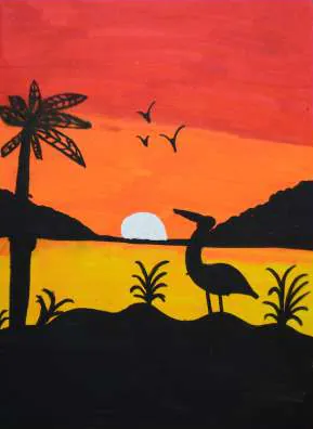 Palm trees and a heron silhouetted against a sunset