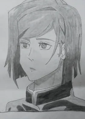 A young man with a fringe of hair, in grey