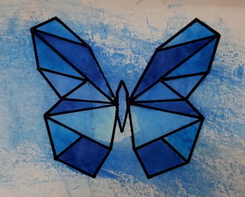 A butterfly of blue geometric facets on a blue and cream ground