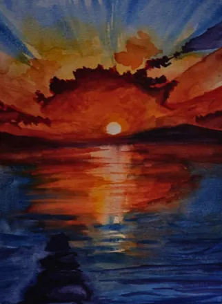 A sunset in red and orange over dark blue water