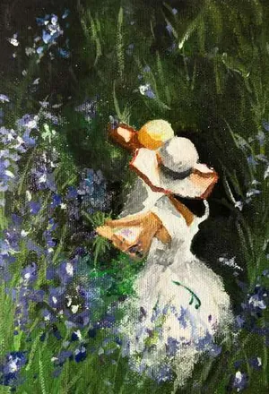 A woman in a white dress and sun hat among blue flowers in long grass