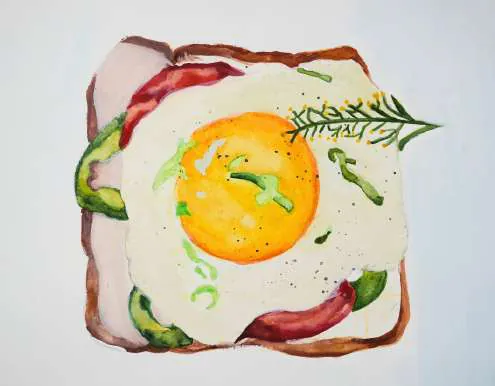 A fried egg on toast with chillies and herbs