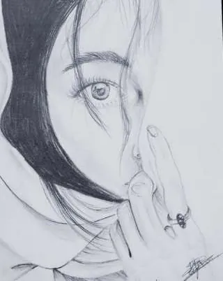 A girl with long dark hair, a finger to her lips, in grey