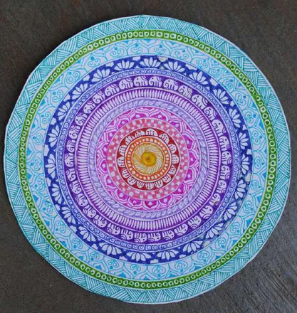 A round mandala in blues, purples and pinks