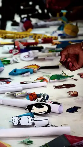 Close view of a table covered with folded and cut paper pieces