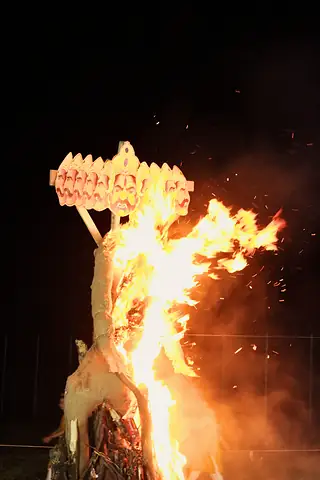 The ten-headed Ravan effigy burning against the night sky