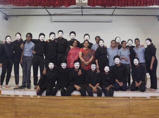 Mime, in white masks