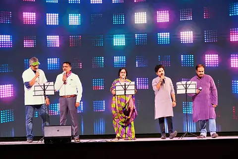 Teachers singing on stage during the Children's Day programme