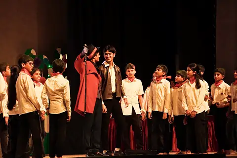 A Masquerade cast on stage in costume