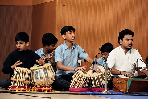 Students accompanying on tabla at the Vasant Panchami music workshop