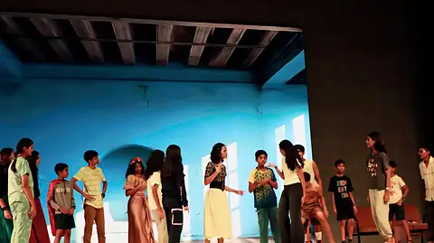 The company across a blue courtyard set