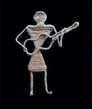 A figure playing a stringed instrument, made of wound brown cord, on black
The Crossroads, Issue 10 · August 2023