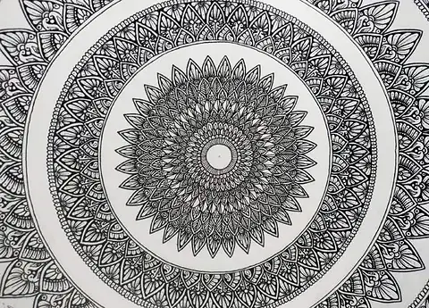 A large round mandala in fine black pattern
The Crossroads, Issue 17 · July 2024