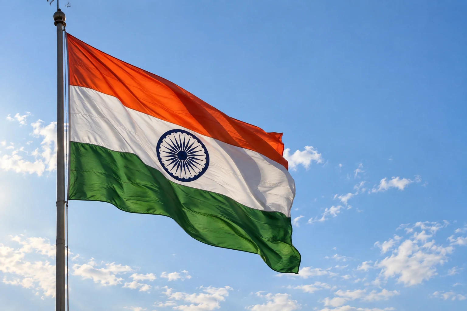 Indian flag flying against a blue sky