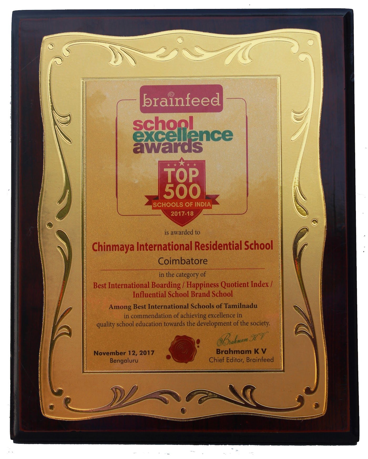 A wooden plaque with a gold panel reading brainfeed school excellence awards, Top 500 Schools of India 2017-18