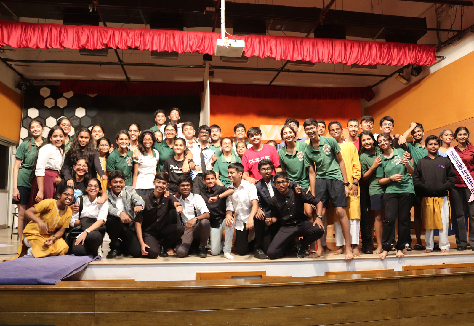 Vishwamitra students and staff gathered together on stage