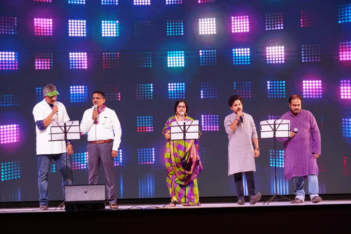 Teachers singing on stage during the Children's Day programme