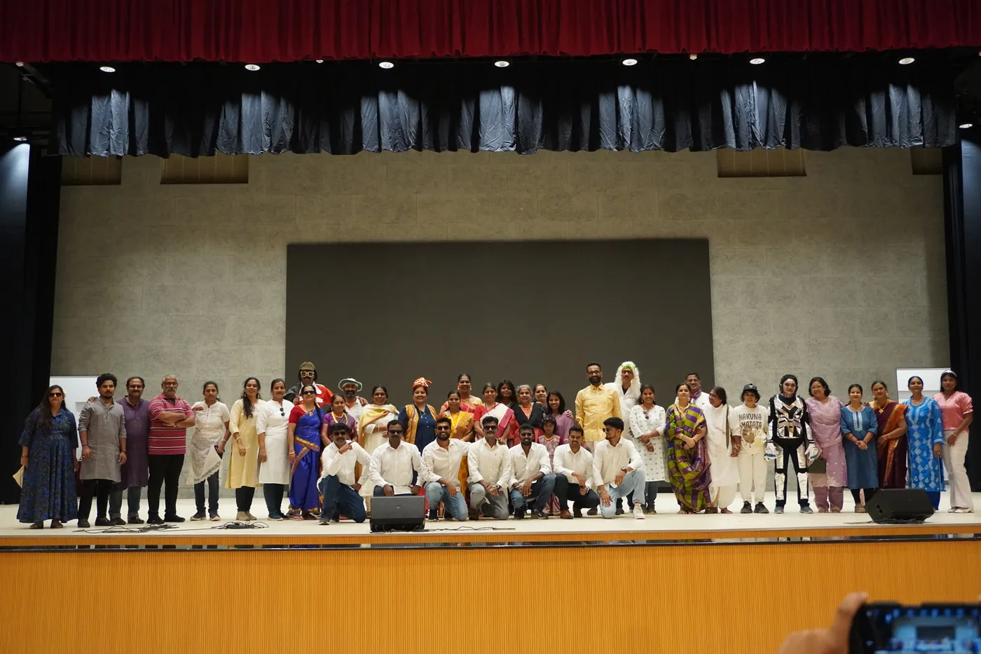 Teachers gathered on stage at the end of the Children's Day programme