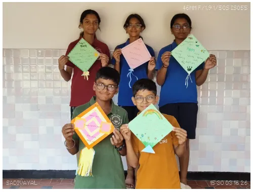Grade 6 students holding up the kites they made for their cinquain poems