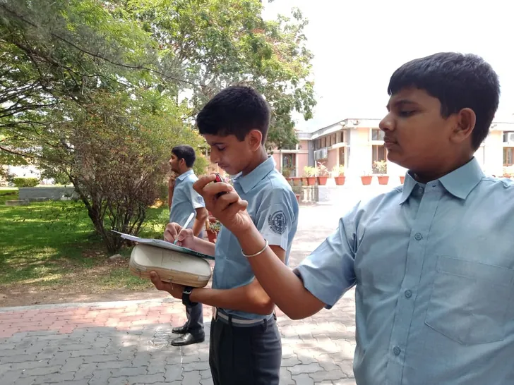 Grade 9 students measuring work and energy on the school ground