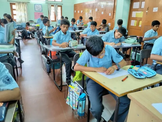 Grade 8 students drawing exponent doodles in class