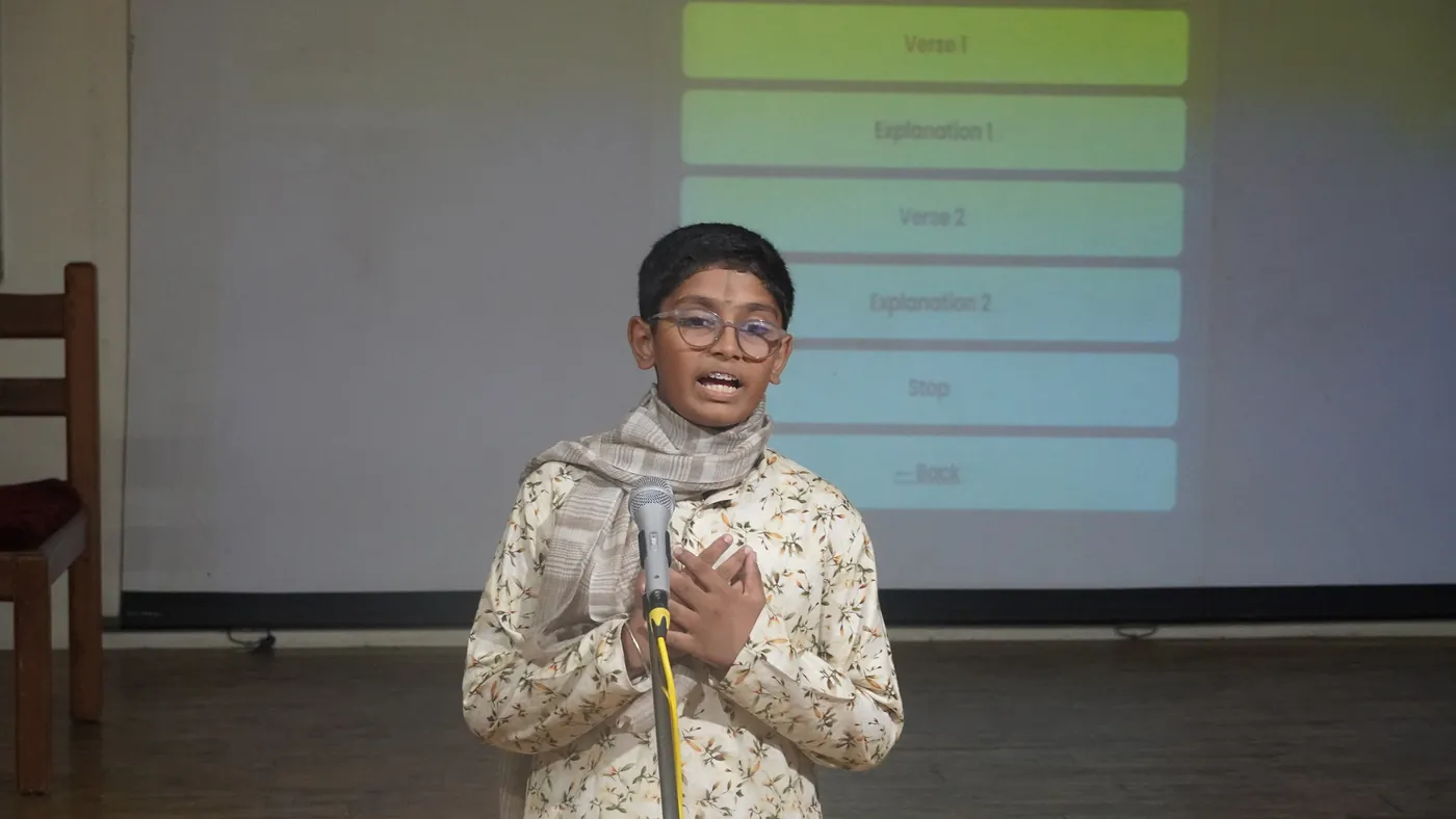 A student speaking on stage during Language Week