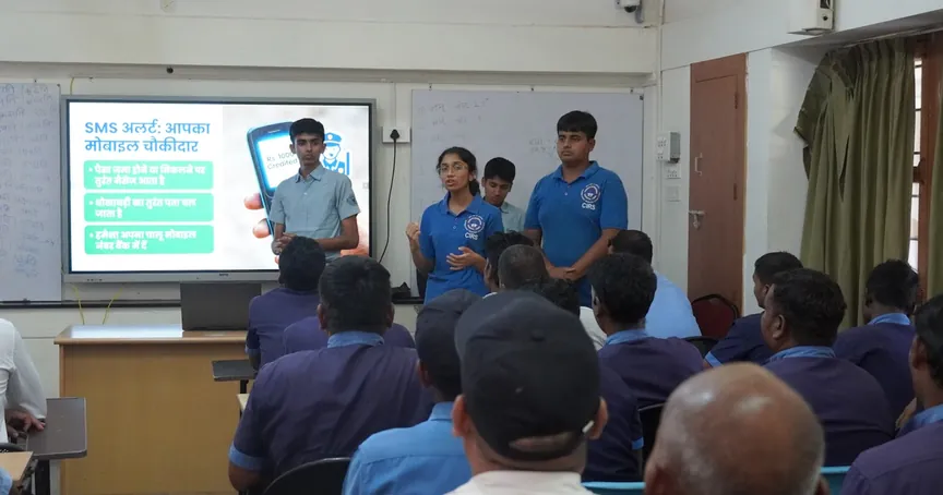 YEI students leading a financial literacy session for the school's support staff