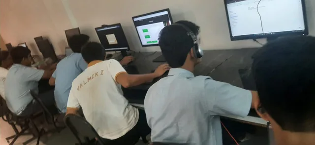 Students seated at computers in a room